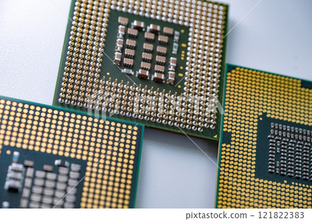 High definition macro shot of CPU processor, electronic components and gold pins High definition macro shot of CPU processor, electronic components and gold pins 121822383