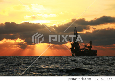 Oil and rig in offshore with sunset and sunrise time. The construction platform for production oil and gas in power and energy industry. 121822457