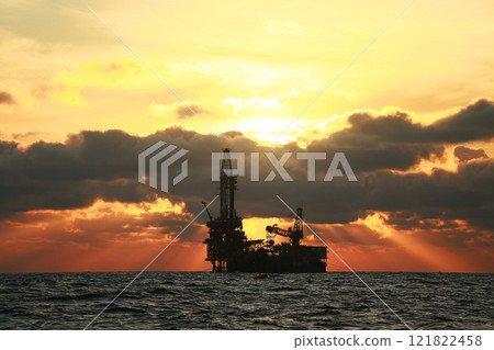 Oil and rig in offshore with sunset and sunrise time. The construction platform for production oil and gas in power and energy industry. 121822458