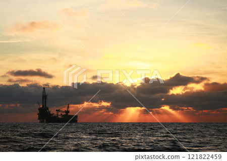 Oil and rig in offshore with sunset and sunrise time. The construction platform for production oil and gas in power and energy industry. 121822459