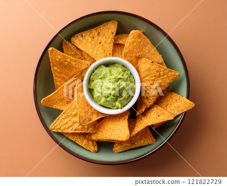 Tortilla chips with guacamole dip 121822729