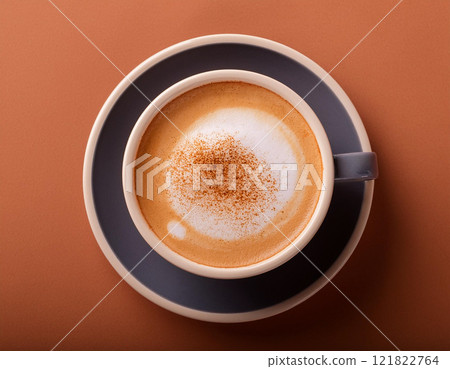 Cappucino coffee cup against mocha mousse background 121822764