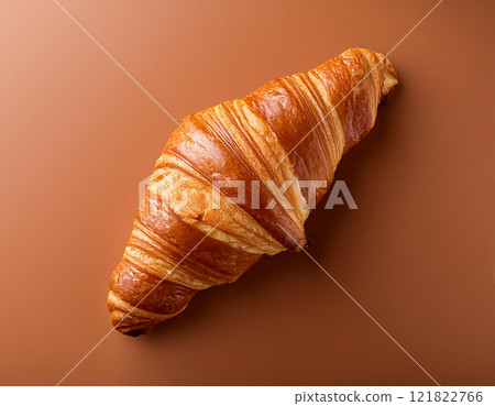 Golden crust croissant against mocha mousse background Golden crust croissant against mocha mousse background 121822766
