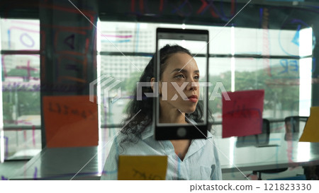 Young hispanic employee writing on colorful sticky notes. Closeup. Manipulator. Young hispanic employee writing on colorful sticky notes. Closeup. Manipulator. 121823330
