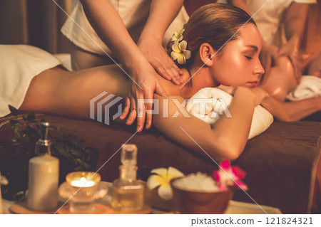 Caucasian couple customer enjoying relaxing anti-stress massage. Quiescent 121824321