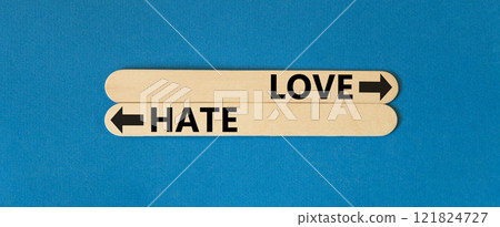 Love or hate symbol. Concept word Love or Hate on beautiful wooden stick. Beautiful blue table blue background. Business and love or hate concept. Copy space. Love or hate symbol. Concept word Love or Hate on beautiful wooden stick. Beautiful blue table blue background. Business and love or hate concept. Copy space. 121824727