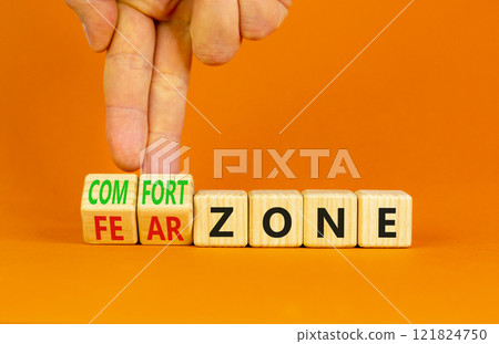 Comfort or fear zone symbol. Concept words Comfort zone Fear zone on wooden cubes. Beautiful orange table orange background. Psychologist hand. Business and comfort or fear zone concept. Copy space. 121824750