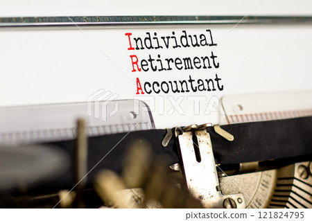 IRA individual retirement account symbol. Concept words IRA individual retirement account typed on retro typewriter. White background. Business IRA individual retirement account concept. Copy space IRA individual retirement account symbol. Concept words IRA individual retirement account typed on retro typewriter. White background. Business IRA individual retirement account concept. Copy space 121824795