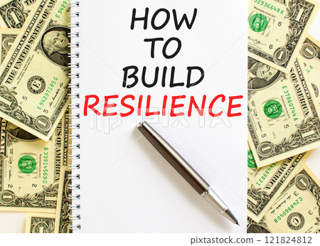 How to build resilience symbol. Concept words How to build resilience on beautiful white note. Beautiful background from dollar bills. Business and how to build resilience concept. Copy space. 121824812