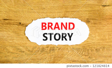 Brand story branding symbol. Concept words Brand story on beautiful white paper. Beautiful wooden background. Business brand story branding concept. Copy space. 121824814