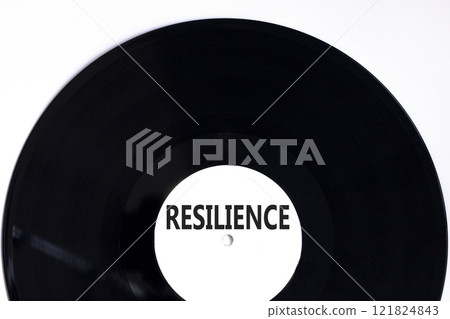 Resilience symbol. Concept word Resilience on beautiful black white vinyl disk. Beautiful white background. Business resilience concept. Copy space. Resilience symbol. Concept word Resilience on beautiful black white vinyl disk. Beautiful white background. Business resilience concept. Copy space. 121824843