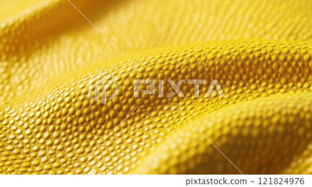 Textured yellow surface with bumpy details highlighting material or fabric concept 121824976