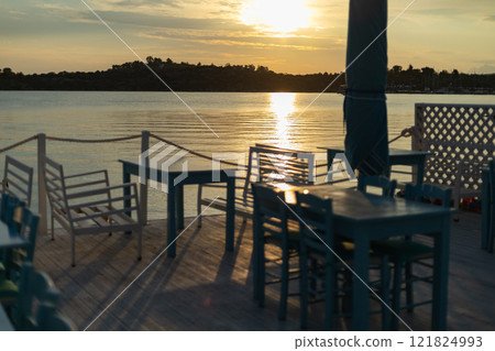 sunrise on the sea coast, cafe on the coast 121824993