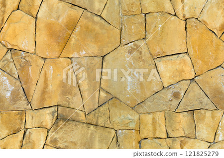 Sturdy yellow and beige cut stone wall, seamless lined up 121825279