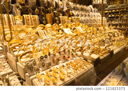 Bracelets on a show window jewelry store, turkish gold shop Bracelets on a show window jewelry store, turkish gold shop 121825373