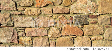 Sturdy beige and purple cut stone wall, seamless lined up Sturdy beige and purple cut stone wall, seamless lined up 121825745