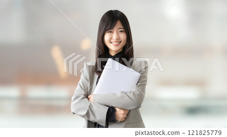 Smiling woman/businesswoman with a laptop 121825779