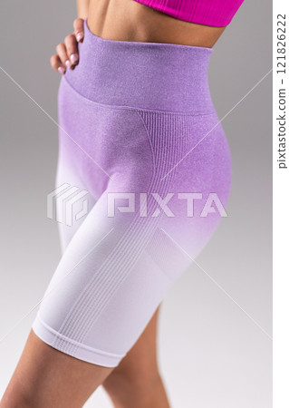 Fashionable Purple Gradient Fitness Shorts on Woman in Activewear, Highlighting Stylish Athletic Apparel Concept 121826222