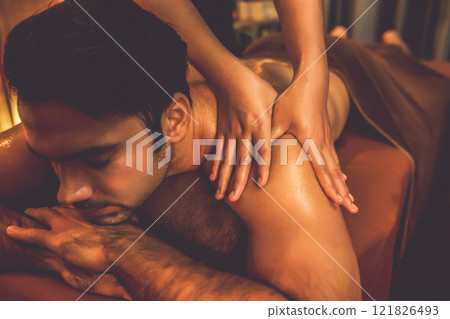 Caucasian man customer enjoying relaxing anti-stress massage. Quiescent Caucasian man customer enjoying relaxing anti-stress massage. Quiescent 121826493