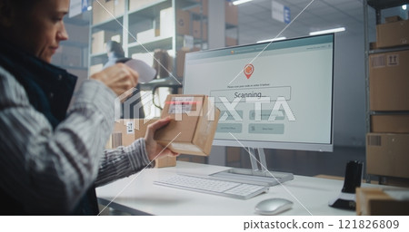 Female Inventory Manager Scans Code. Computer Screen Shows Delivery Tracking System for Monitoring Package 121826809
