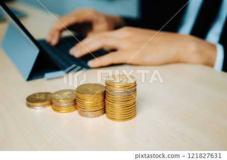 Businessman working with coin money currency. uds Businessman working with coin money currency. uds 121827631