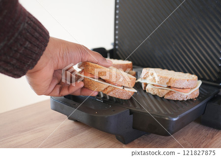 Enjoy grilling a delicious burger with fresh, quality ingredients for the best flavors 121827875