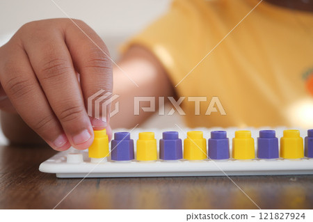 Engaging Child Learning with a Fun and Educational Abacus for Enhanced Development and Creativity 121827924