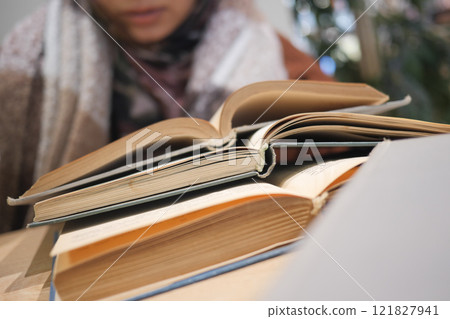 Engaging in productive study sessions with Open Books in a Cozy Environment Engaging in productive study sessions with Open Books in a Cozy Environment 121827941