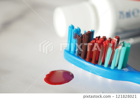 Blood on the toothbrush on background Blood on the toothbrush on background 121828021
