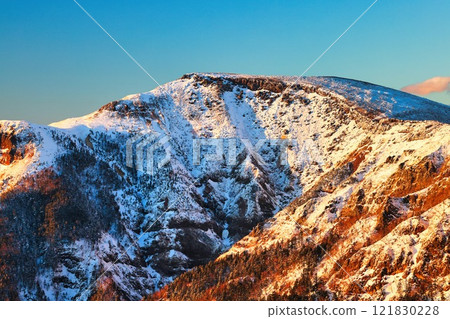 Iodake in the Yatsugatake mountain range with snow cap at sunset Iodake in the Yatsugatake mountain range with snow cap at sunset 121830228