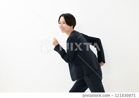 A woman in a running pose A woman in a running pose 121830871