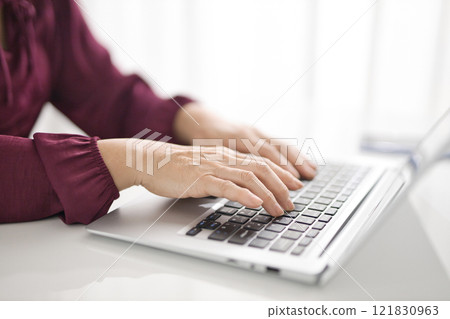 Middle female watching personal computer 121830963