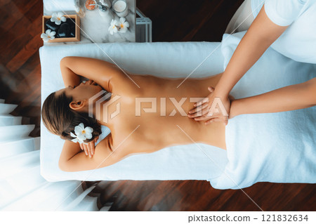 Caucasian woman customer enjoying relaxing anti-stress massage. Quiescent Caucasian woman customer enjoying relaxing anti-stress massage. Quiescent 121832634