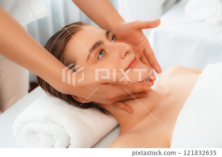 Caucasian woman enjoying relaxing anti-stress head massage. Quiescent Caucasian woman enjoying relaxing anti-stress head massage. Quiescent 121832635