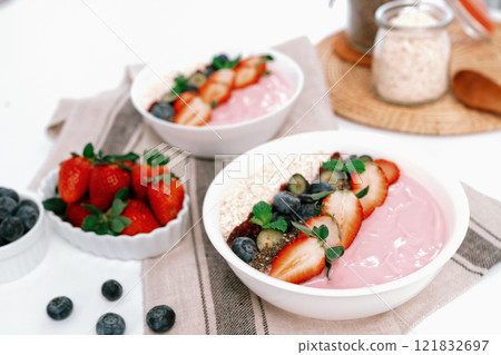 Presented of healthy fruits putting yogurt toppings with strawberry. Pecuniary. Presented of healthy fruits putting yogurt toppings with strawberry. Pecuniary. 121832697