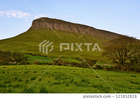 Benbulbin mountain in Sligo Ireland - Majestic Green Mountain Featuring a Stunning View Under a Benbulbin mountain in Sligo Ireland - Majestic Green Mountain Featuring a Stunning View Under a 121832818
