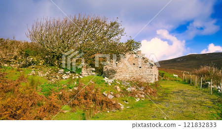 The Irish West Coast in Donegal Ireland - An Abandoned Stone Cottage That Is Beautifully Surrounded 121832833