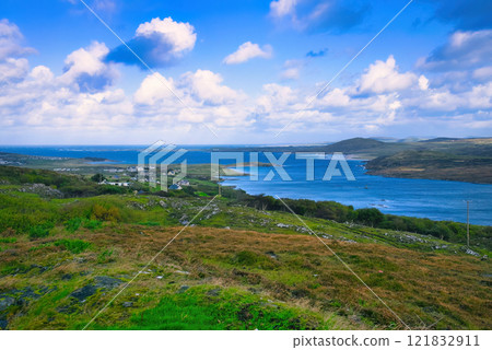 Donegal - A Picturesque Coastal Landscape featuring Calming Waters and Vibrant Lush Greenery all 121832911