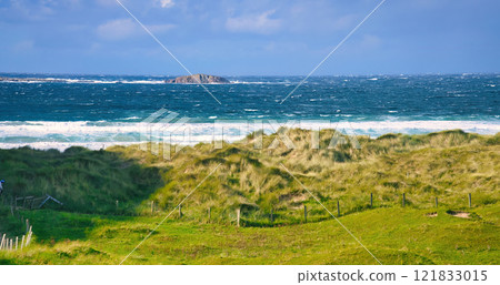 Donegal - A Picturesque Coastal Landscape featuring Calming Waters and Vibrant Lush Greenery all 121833015