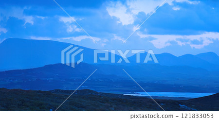 The Misty Mountains are beautifully framed under dramatic and captivating clouds overhead The Misty Mountains are beautifully framed under dramatic and captivating clouds overhead 121833053