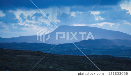 The Misty Mountains are beautifully framed under dramatic and captivating clouds overhead The Misty Mountains are beautifully framed under dramatic and captivating clouds overhead 121833066