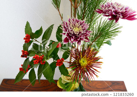 New Year's flowers such as pine, chrysanthemum, and senryo displayed in a vase New Year's flowers such as pine, chrysanthemum, and senryo displayed in a vase 121833260