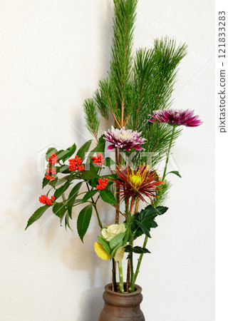 New Year's flowers such as pine, chrysanthemum, and senryo displayed in a vase New Year's flowers such as pine, chrysanthemum, and senryo displayed in a vase 121833283