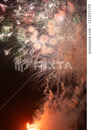 Peony fireworks covered in white smoke Peony fireworks covered in white smoke 121833379