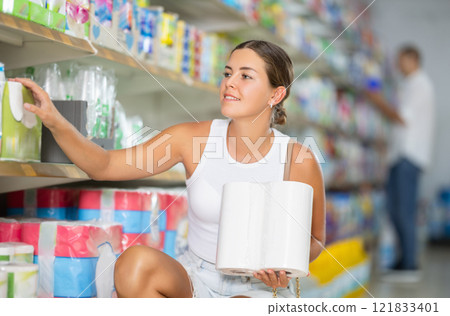 Young woman choosing paper towels in store Young woman choosing paper towels in store 121833401