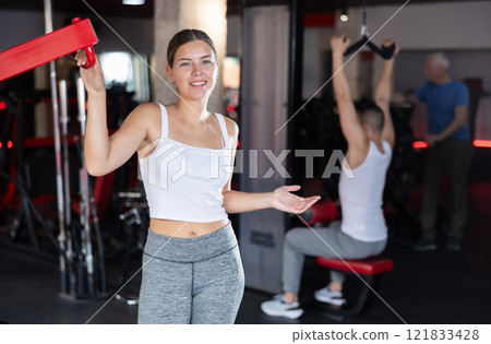 Young athletic woman posing in gym Young athletic woman posing in gym 121833428