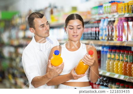 Couple man and woman choosing soda 121833435