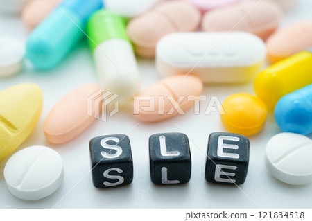 SLE systemic Lupus erythematosus or Lupus word with pills and capsules medical drug. SLE systemic Lupus erythematosus or Lupus word with pills and capsules medical drug. 121834518