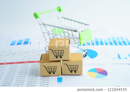 Online shopping, Shopping cart box on business graph, import export, finance commerce. 121834535