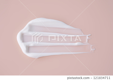 A smear of white cream on a pink background. 121834711